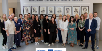 Representatives from various local organizations pose for a group photo at the first Płock Local Stakeholders Meeting.